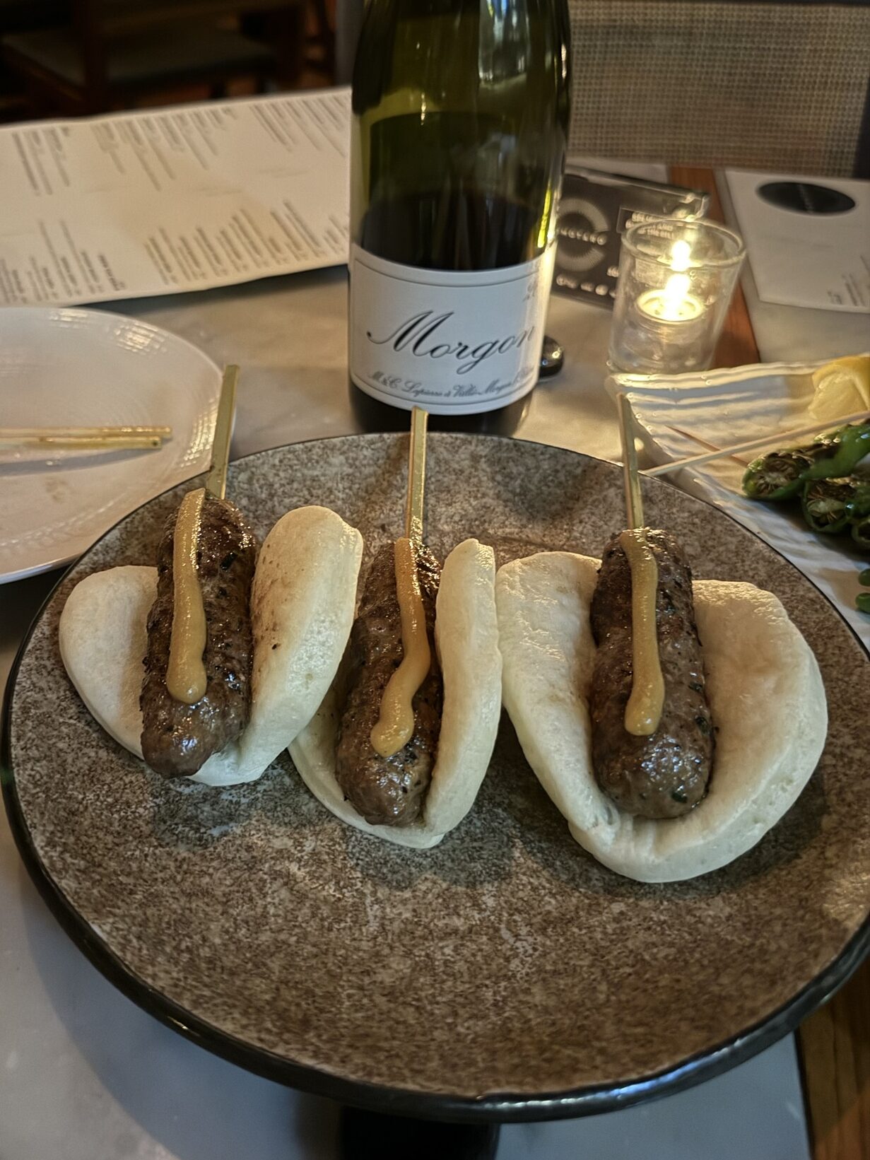 wagyu beef sliders with miso mustard inside of a bao bun from Momotaro in Chicago